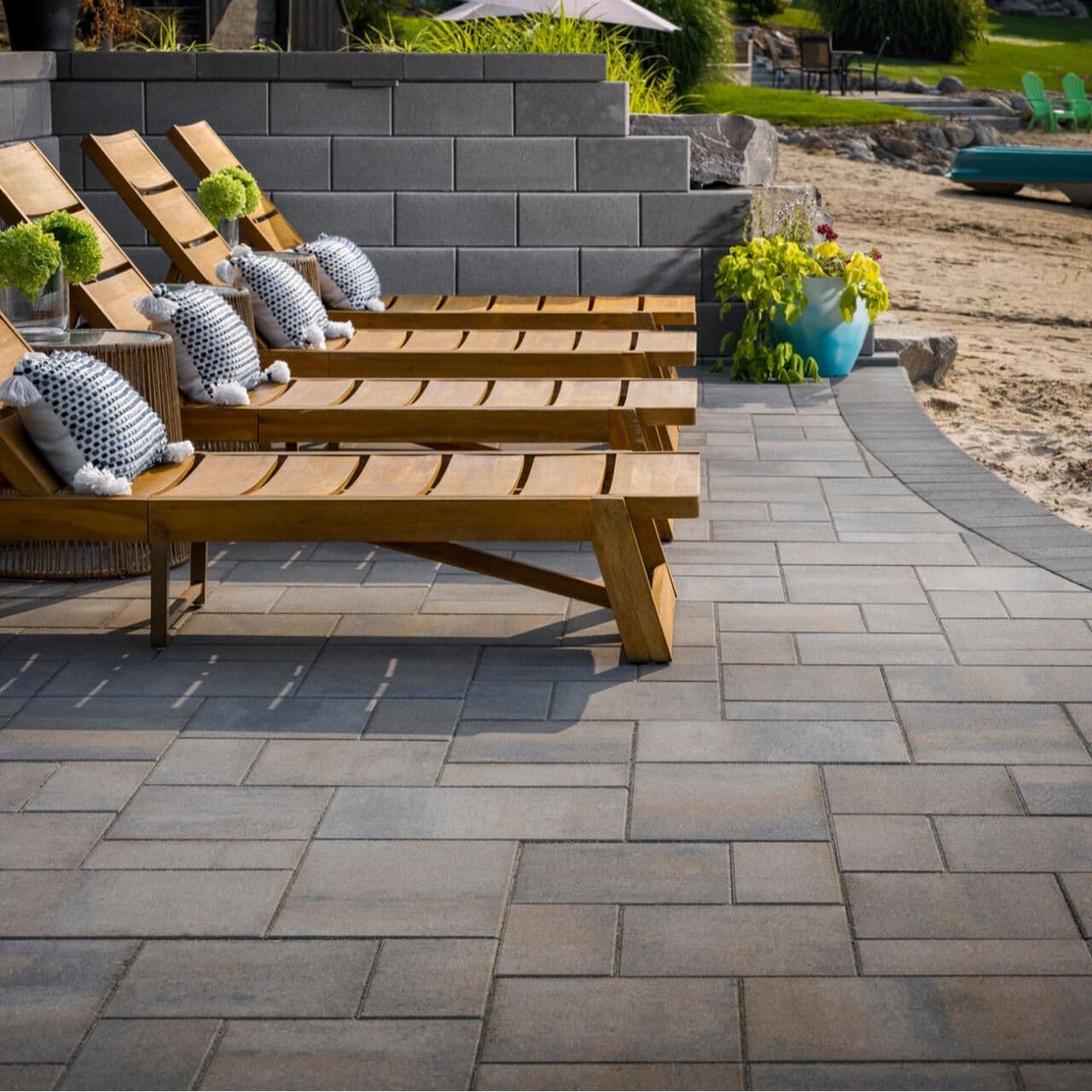 Smooth Dimensions paving stone patio with loungers, laid on a compacted aggregate base