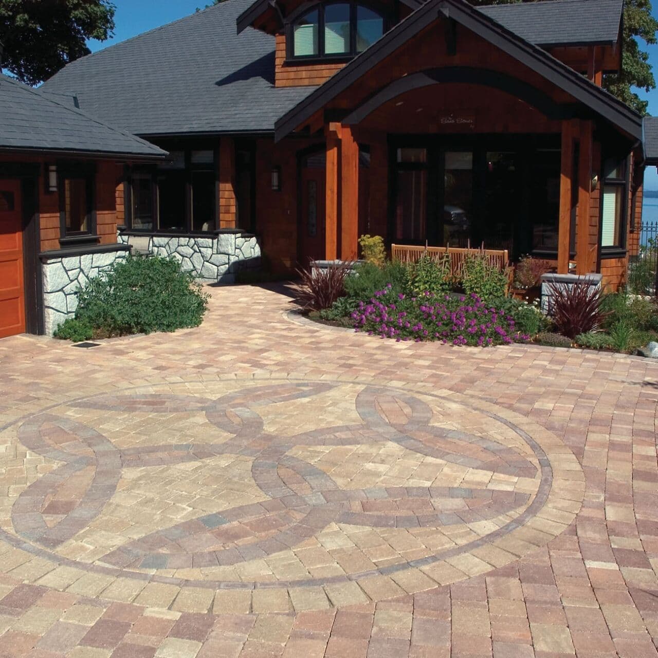 Old Country Stone driveway with a circular paving stone medallion — Daedalus Contracting, Lower Mainland BC