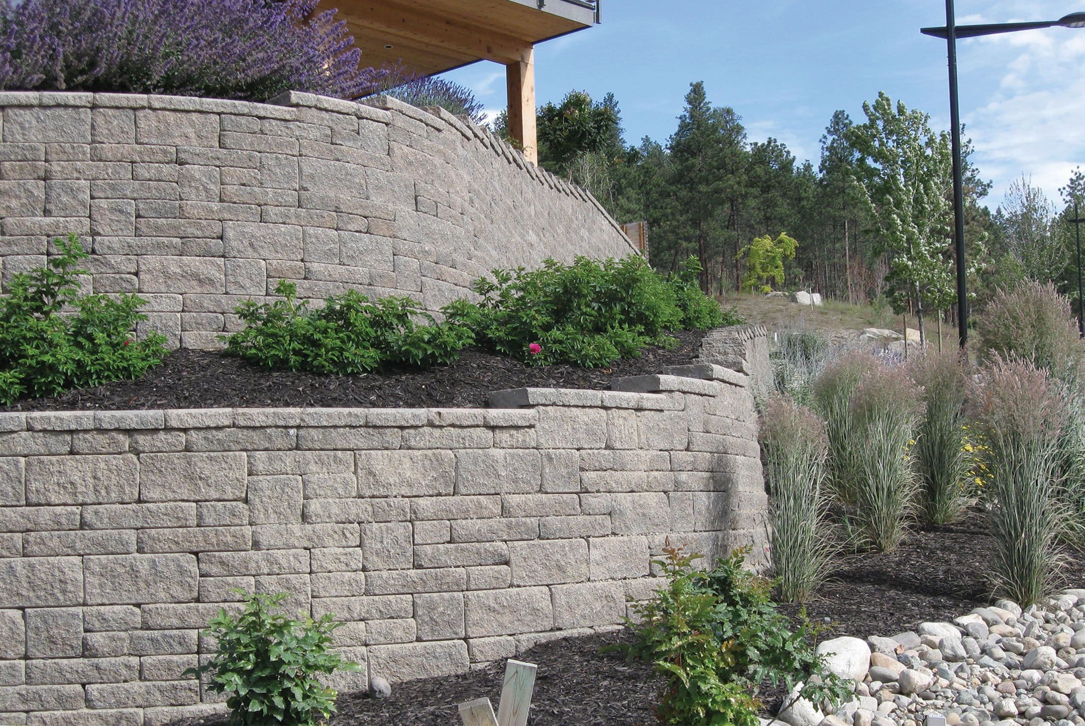 Terraced Allan Block retaining wall built on a compacted gravel base